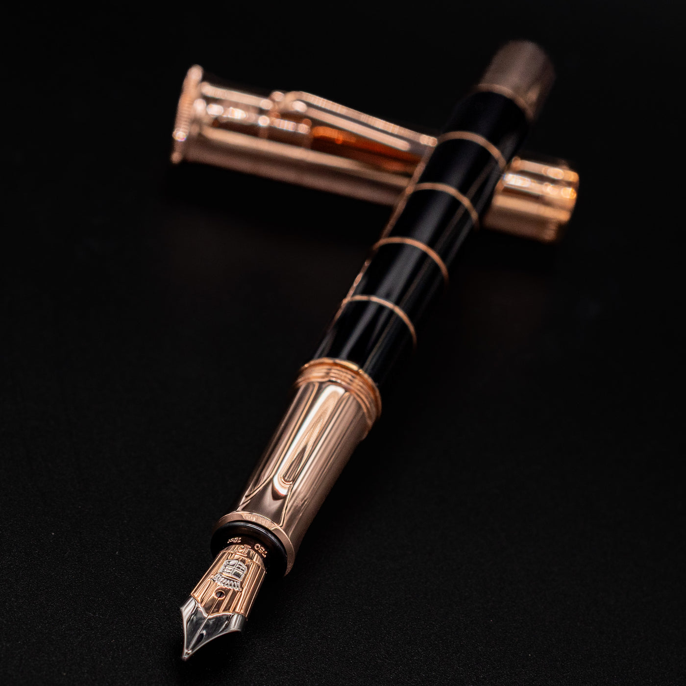 Close-up of the Graf von Faber-Castell Classic Anello Fountain Pen nib in Rose Gold finish, pen resting horizontally.