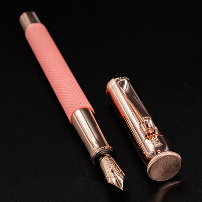 Graf von Faber-Castell Guilloche Fountain Pen - Rose resting horizontally with cap removed