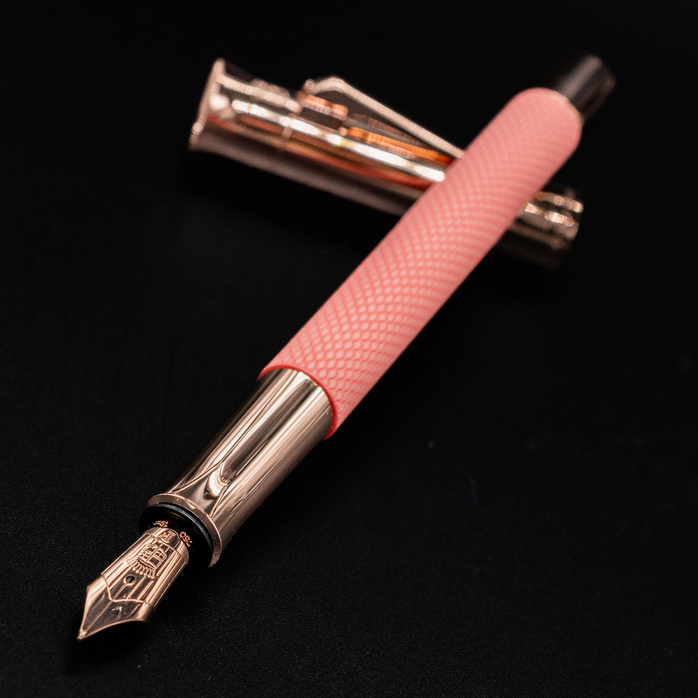 Graf von Faber-Castell Guilloche Fountain Pen - Rose shown uncapped with nib pointing left