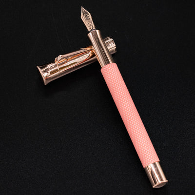 Graf von Faber-Castell Guilloche Fountain Pen - Rose displayed cross-style with open cap