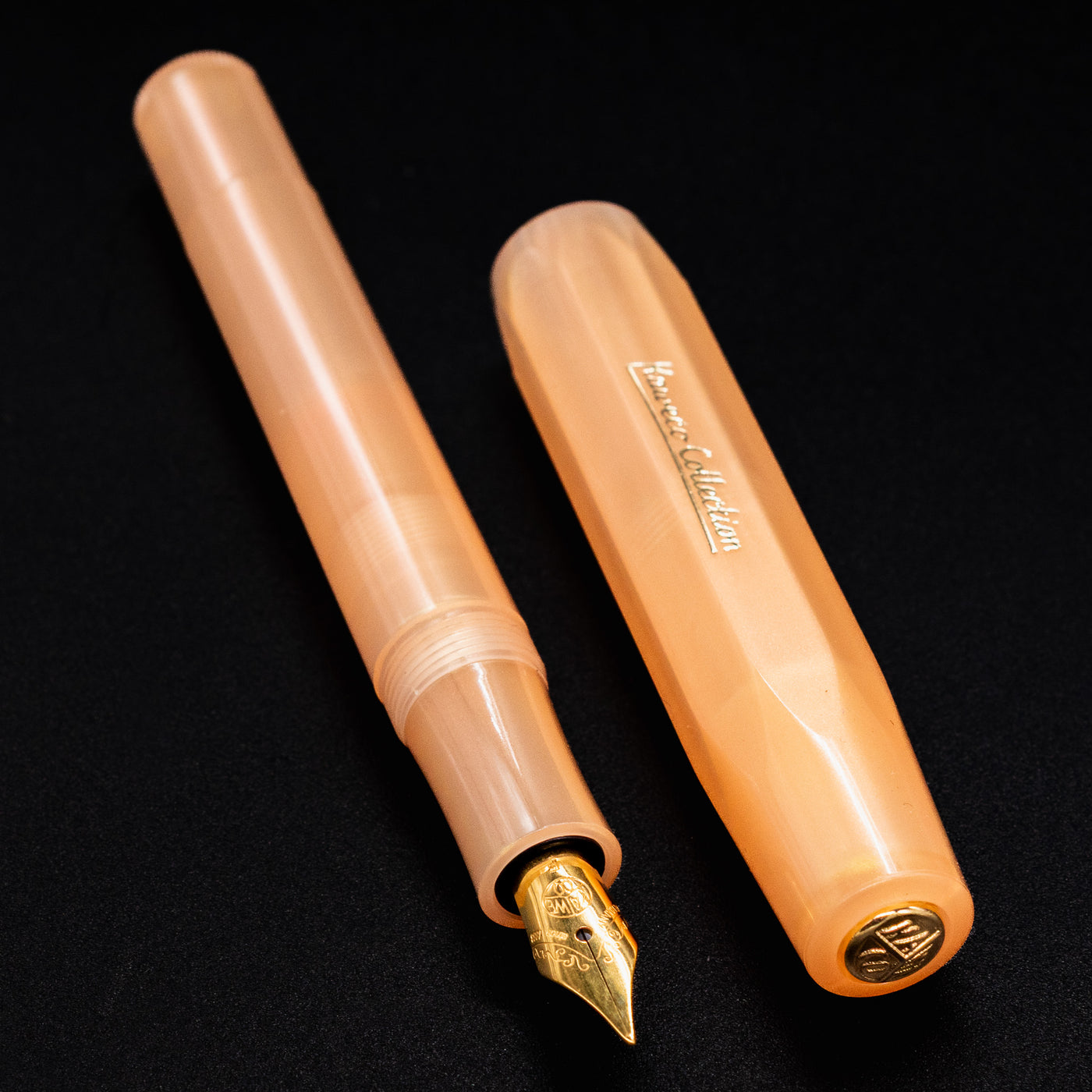 Kaweco Collector's Sport Apricot Pearl Fountain Pen with its matching cap displayed side-by-side.