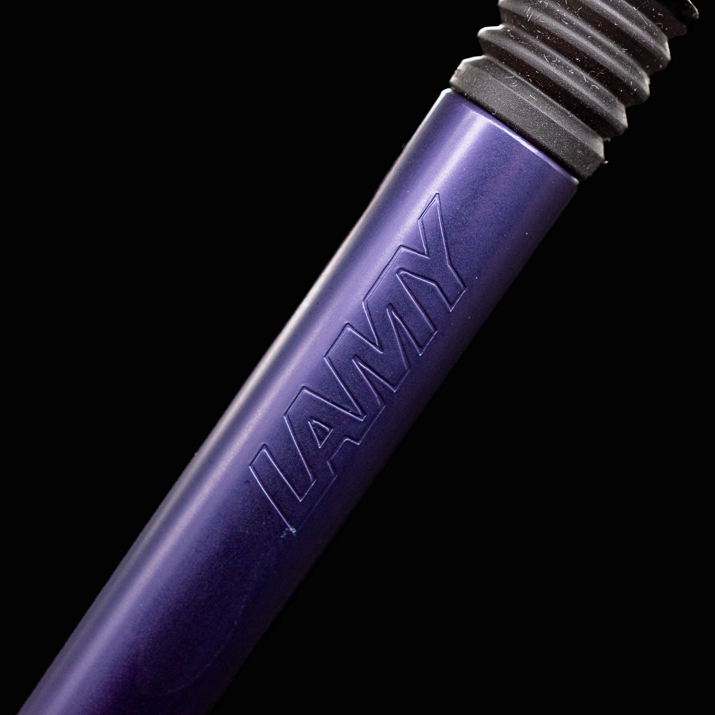  Engraved LAMY logo detail on Dark Dusk Al-Star Ballpoint Pen – anodized aluminum finish