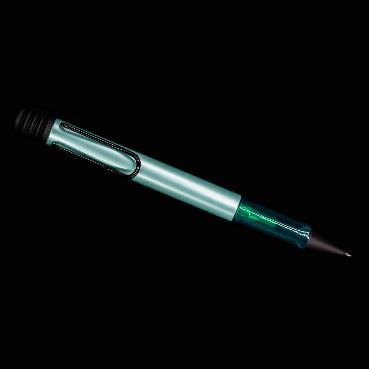 Full view of the LAMY Al-Star Ballpoint Pen in Mint with black trim and clip against black background.