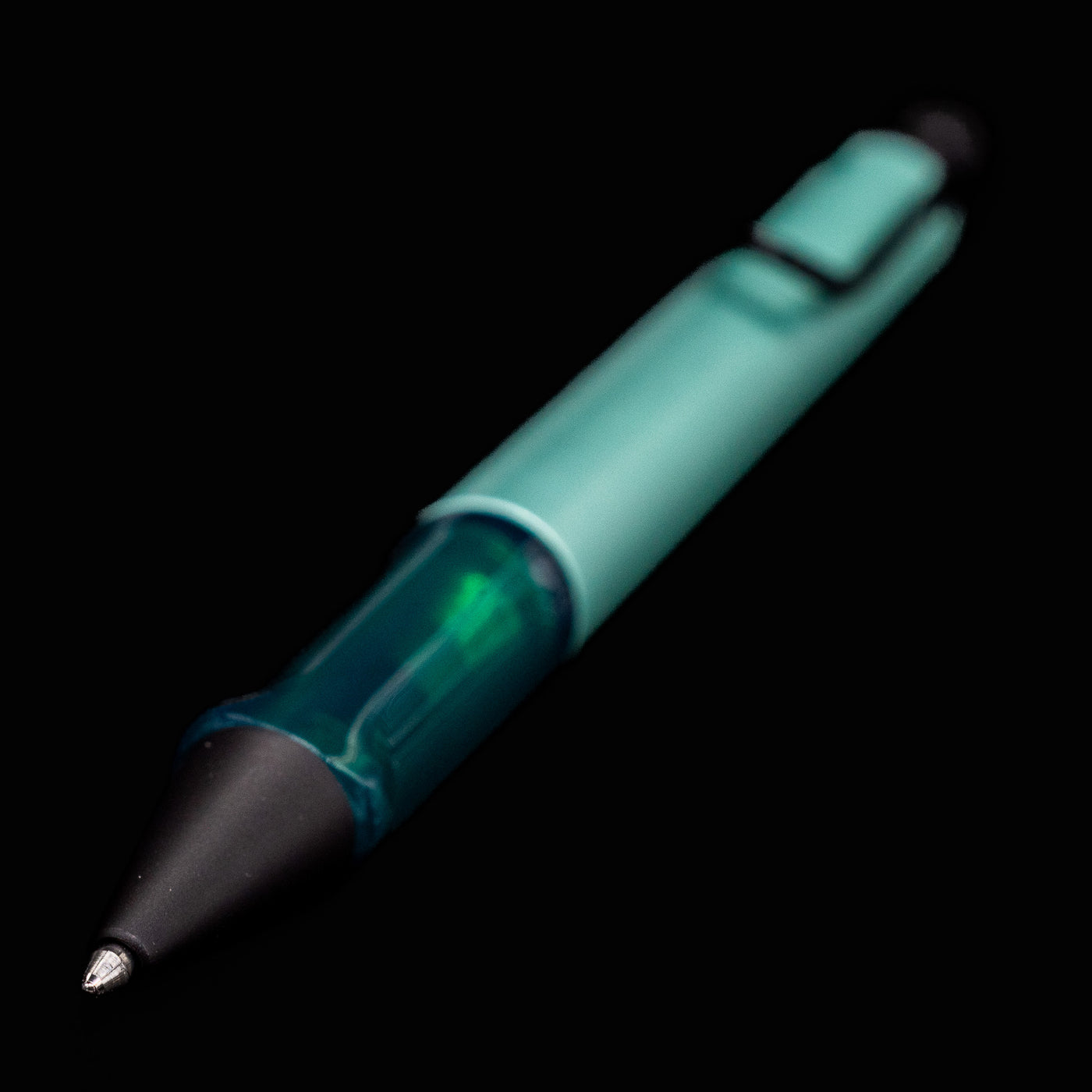 Close-up of the writing tip and translucent grip of the LAMY Al-Star Ballpoint Pen in Mint.