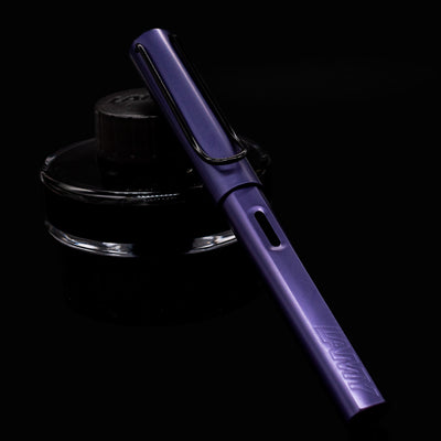 LAMY Al-Star Fountain Pen in Dark Dusk shown capped at a front angle on black background