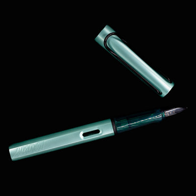 LAMY Al-Star Fountain Pen Mint with nib pointing down on a dark background