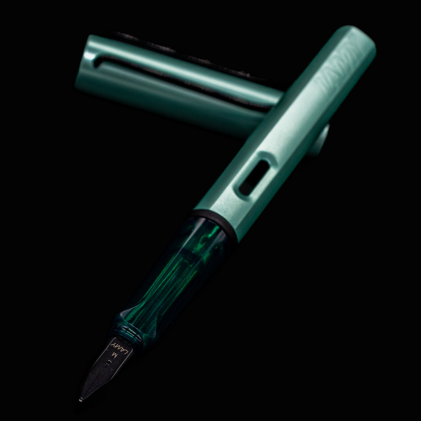 Close-up of the LAMY Al-Star Fountain Pen Mint steel nib and transparent grip section
