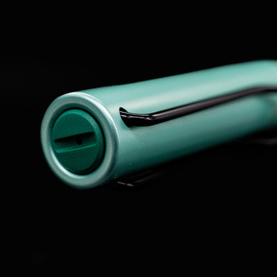 Close-up of the cap and black wire clip of the LAMY Al Star Rollerball Pen in Mint