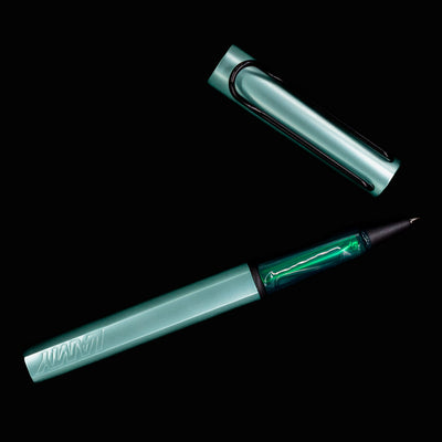 LAMY Al Star Rollerball Pen in Mint fully open and unposted against a black background