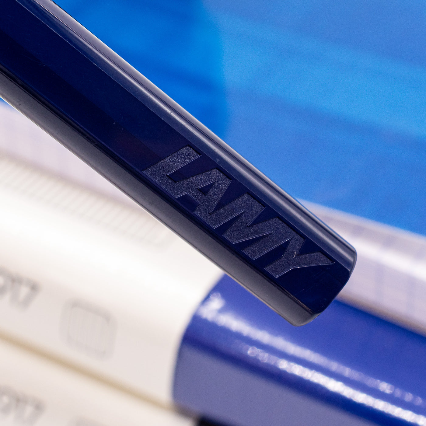 Close-up of the LAMY logo on the barrel of the Dark Dusk rollerball pen