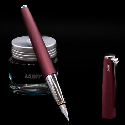 LAMY Studio Orion Fountain Pen propped on a bottle of ink