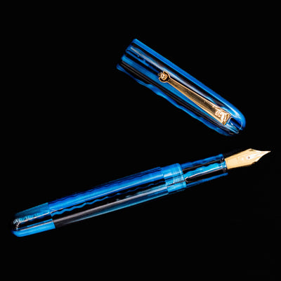 Overhead view of Molteni Modelo 71 Blue & Gold Fountain Pen fully open with cap and barrel side by side.