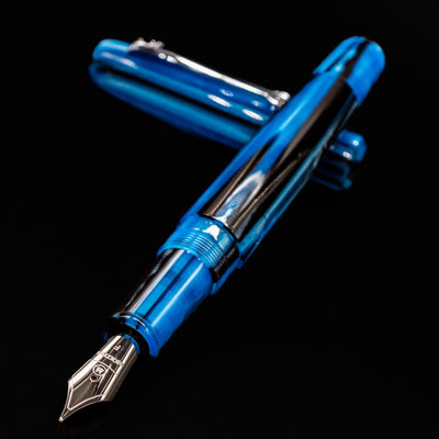 Horizontal close-up of Molteni Modelo 71 Blue & Rhodium Fountain Pen with nib exposed.