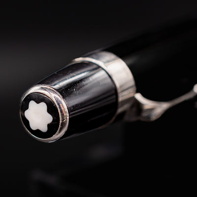 Close-up of Montblanc snowcap emblem on the Boheme No Stone Ballpoint Pen cap finial with platinum ring