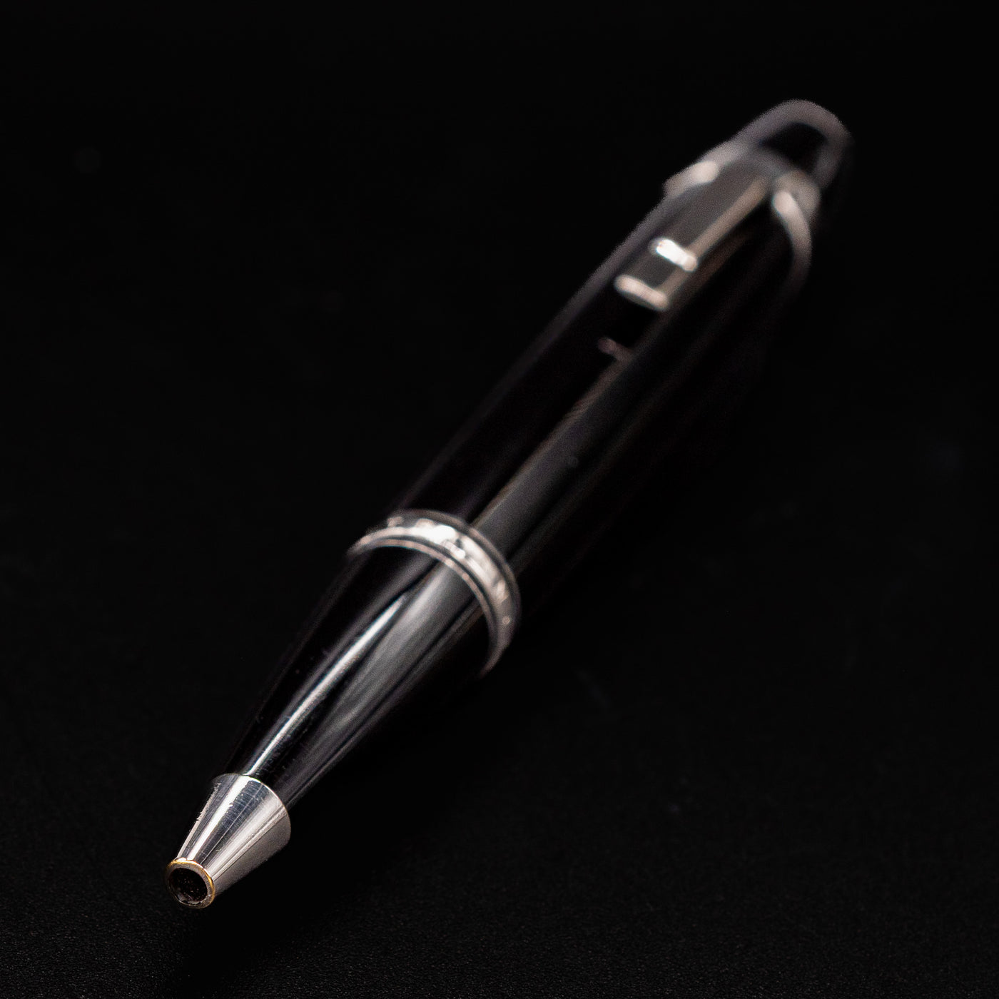 Close-up of Montblanc Boheme No Stone Ballpoint Pen tip with platinum cone and glossy black resin body