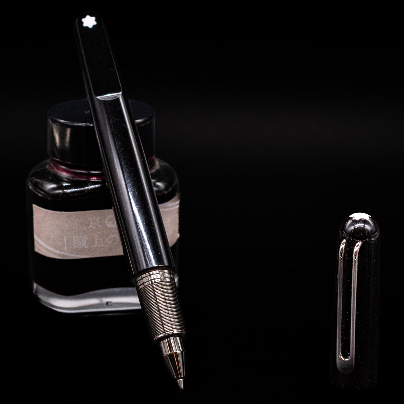 montblanc m by marc newson rollerball with a black background