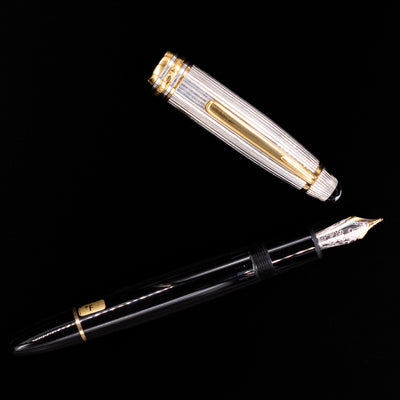 Montblanc Meisterstück 146DS Solitaire Doue LeGrand fountain pen with cap removed and laid separately from the nib and barrel