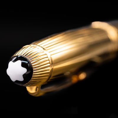 Macro close-up of Montblanc white star emblem on cap of the 146V Vermeil Pinstripe LeGrand Fountain Pen