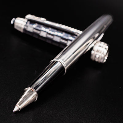 Close-up of Montblanc Meisterstuck 163 Ceramics Prisma Rollerball Pen nib with cap in background