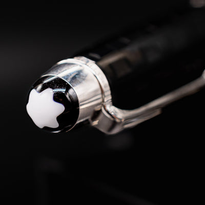 Close-up of Montblanc snowcap emblem on the Solitaire Ceramics Prisma Rollerball Pen cap finial