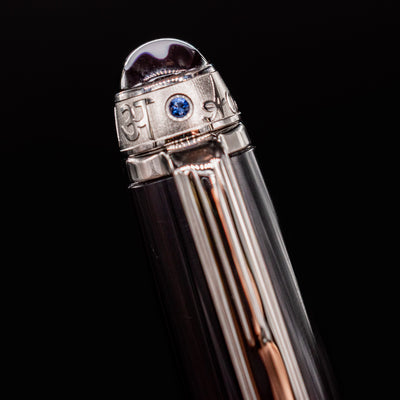Platinum cap band with blue sapphire accent on Montblanc Meisterstück 164 UNICEF Ballpoint Pen – preowned close-up