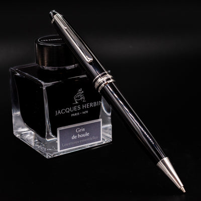 Montblanc Meisterstuck 165P Black and Platinum Mechanical Pencil resting on Jacques Herbin ink bottle - Preowned