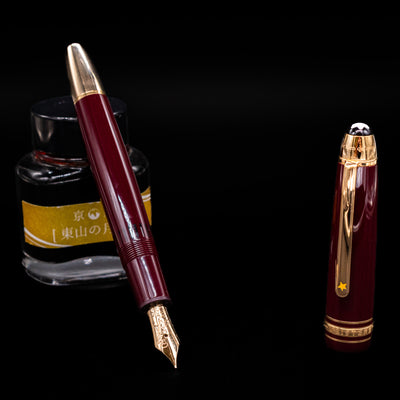 Montblanc Meisterstück Le Petit Prince Planet LeGrand Fountain Pen open with ink bottle in background