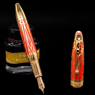 Montblanc Meisterstuck The Origin Collection Solitaire Doue LeGrand Fountain Pen with nib resting on Jacques Herbin ink bottle.