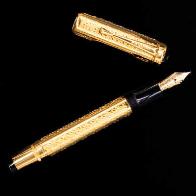 Flatlay of Montblanc Patron of Art Louis XIV 4810 Fountain Pen with cap placed separately