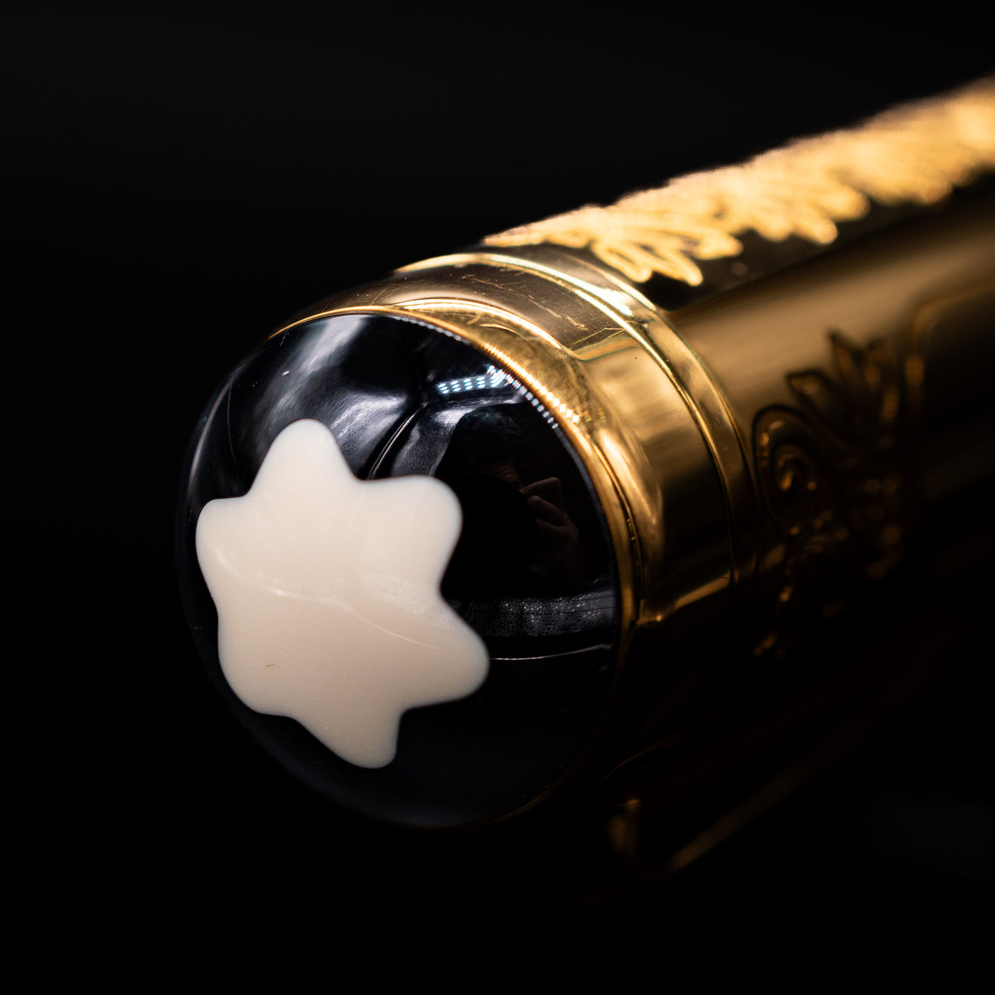 Close-up of Montblanc emblem on Patron of Art Louis XIV Fountain Pen cap finial
