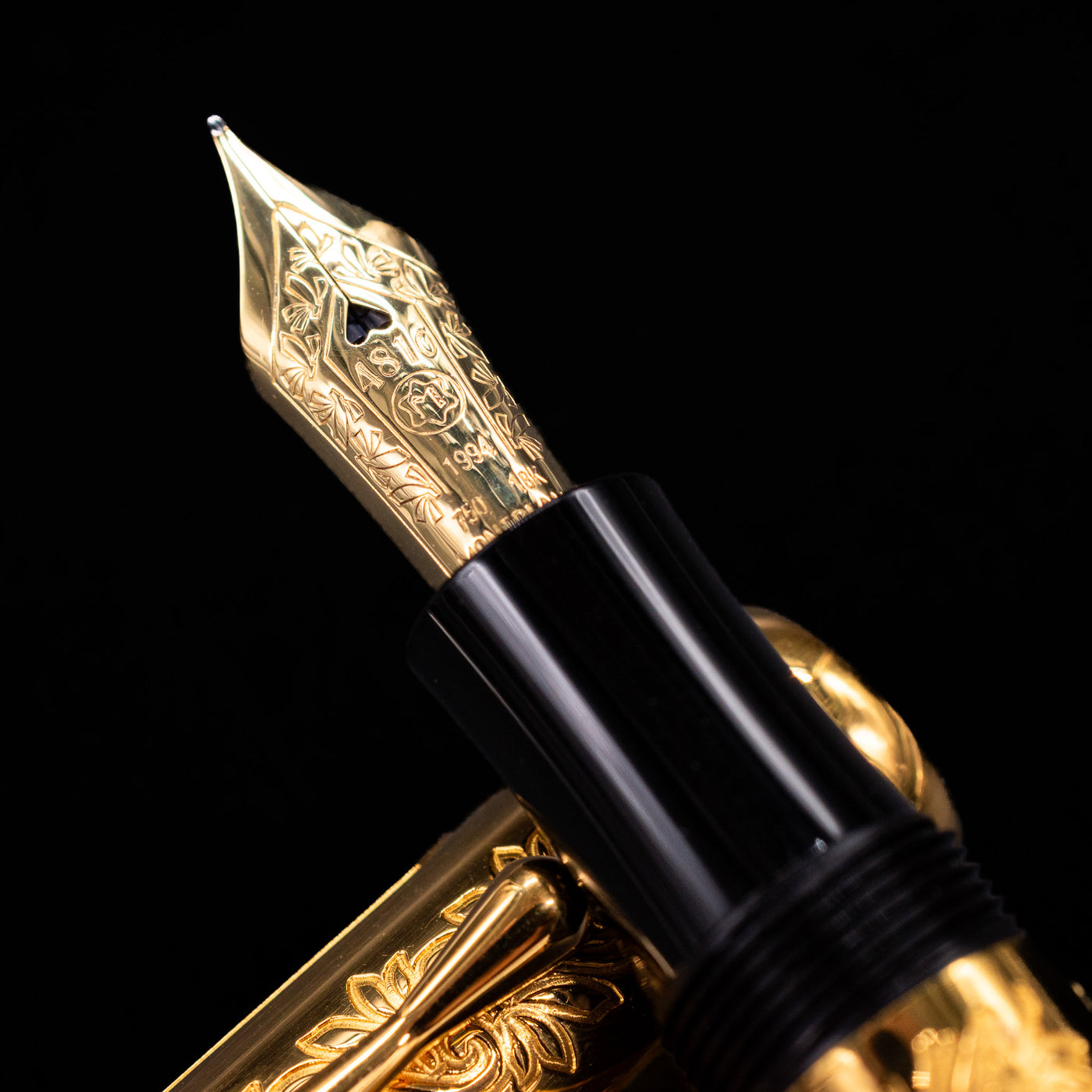 Close-up of 18k gold nib on Montblanc Patron of Art Louis XIV Fountain Pen with detailed scrollwork