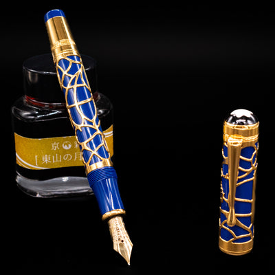 Montblanc Patron of Art Prince Regent 4810 Fountain Pen with royal blue barrel and gold overlay, displayed capped