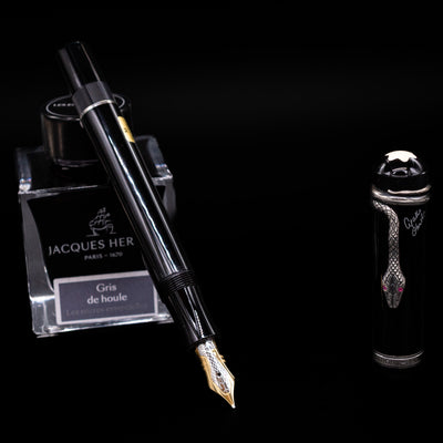 Angled shot of the Montblanc Agatha Christie fountain pen showing the silver snake clip wrapped around the black barrel.