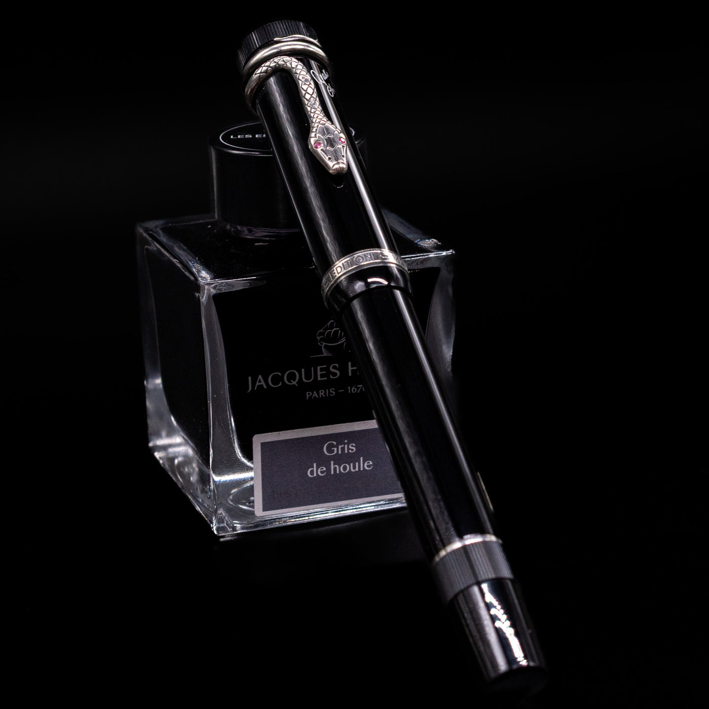 Full-length view of the Montblanc Writer's Edition Agatha Christie Fountain Pen with cap on, showcasing its classic black resin body and snake clip.
