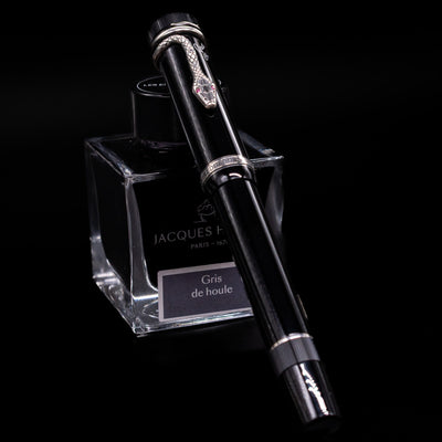 Full-length view of the Montblanc Writer's Edition Agatha Christie Fountain Pen with cap on, showcasing its classic black resin body and snake clip.