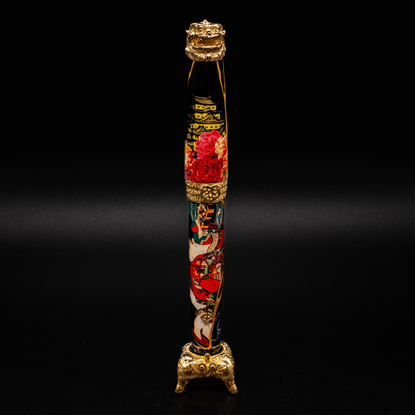 Capped Montegrappa Bijo-To-Yaju fountain pen resting in its sterling silver display stand

