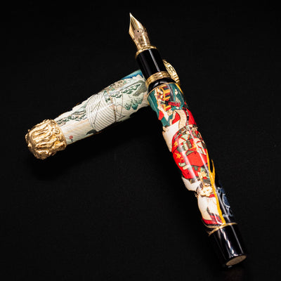 Uncapped Montegrappa Bijo-To-Yaju pen with cap resting on barrel