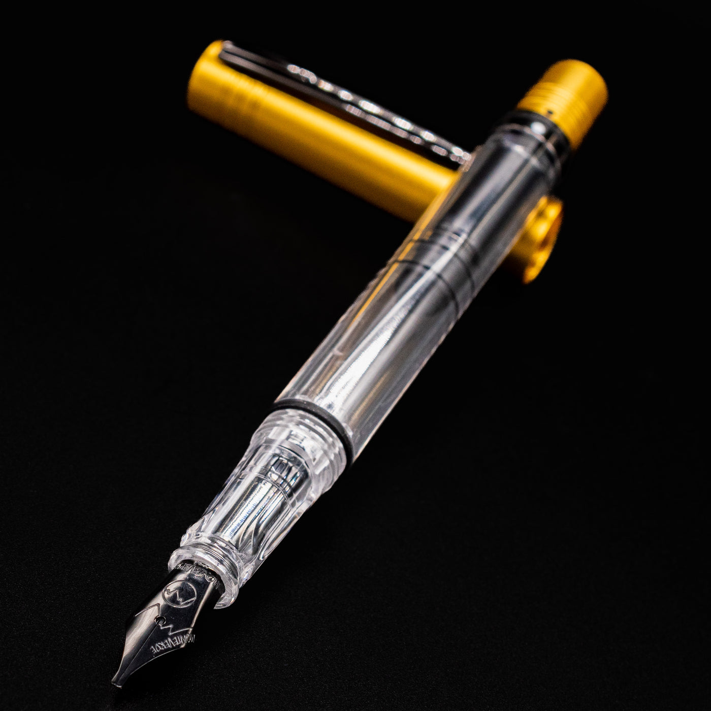 Close-up of the Monteverde MP1 Honey Yellow Fountain Pen showing the transparent barrel and stainless steel nib.