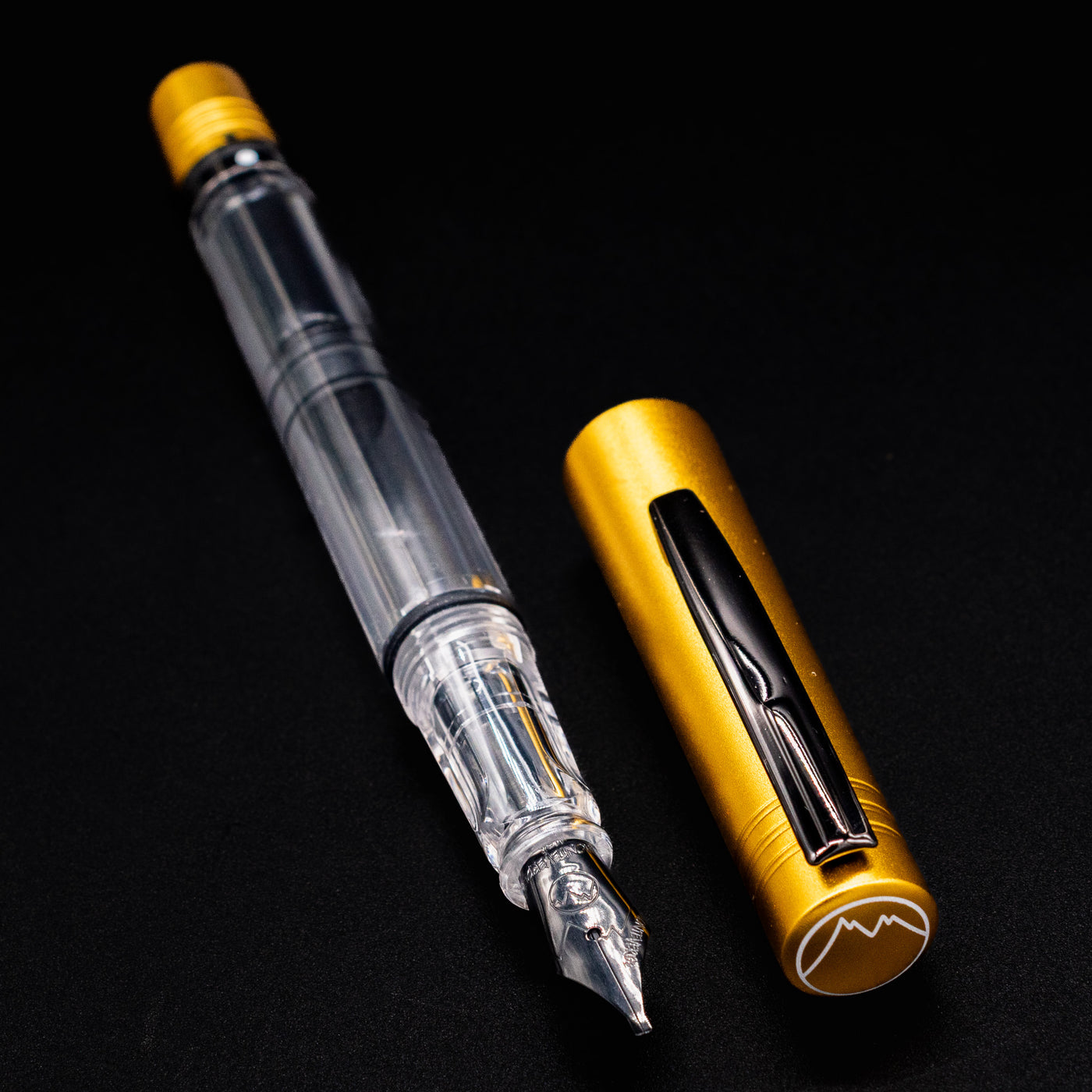 Monteverde MP1 Honey Yellow Fountain Pen shown uncapped, with cap beside it featuring a black clip.
