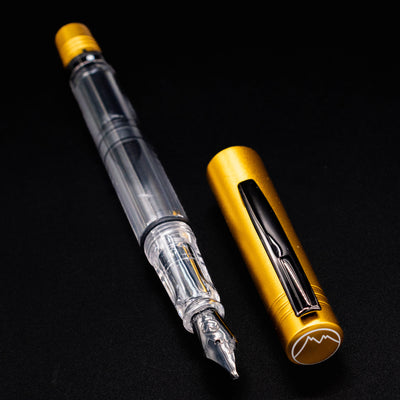 Monteverde MP1 Honey Yellow Fountain Pen shown uncapped, with cap beside it featuring a black clip.