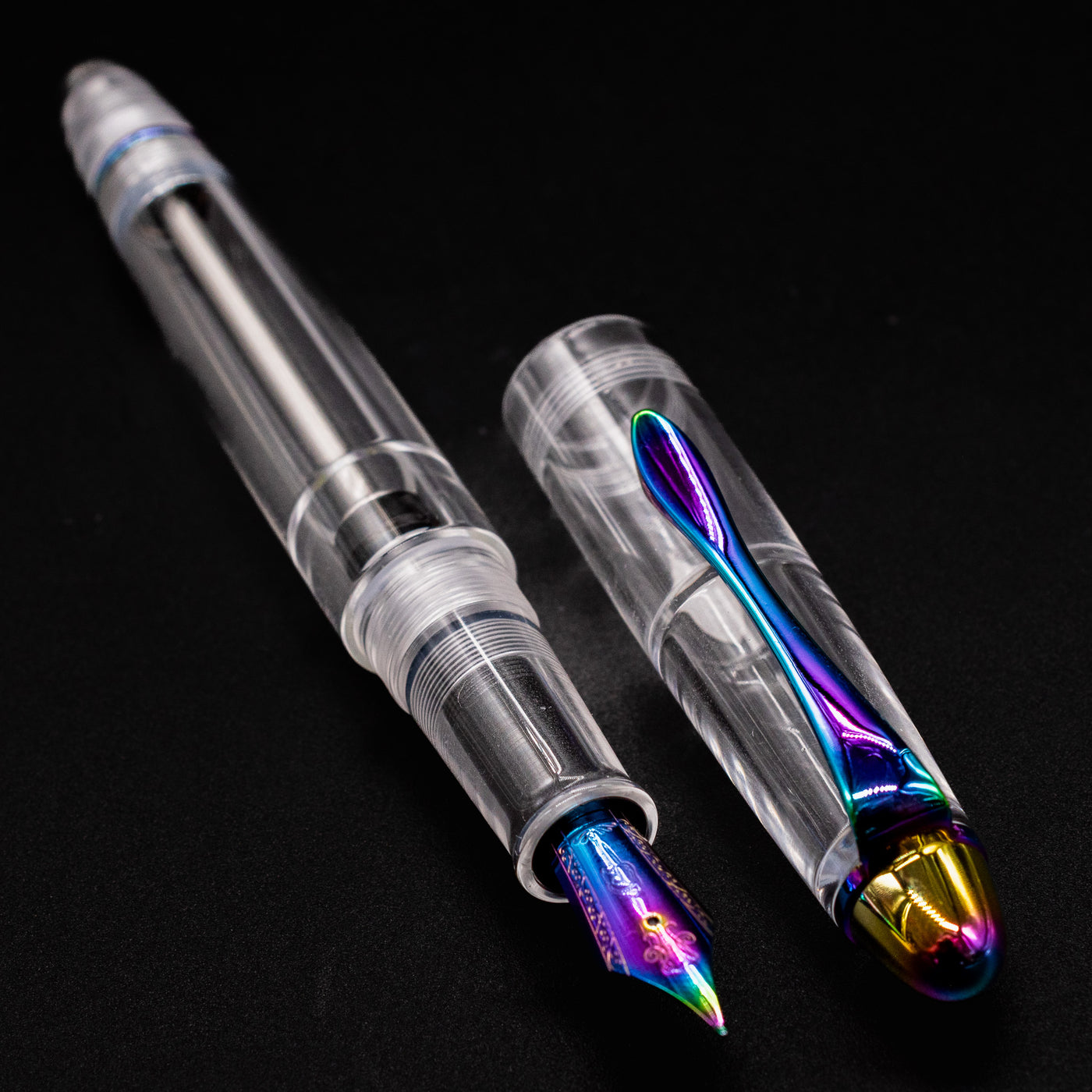 Close-up of Nahvalur Fathom Pride 2025 rainbow nib on clear fountain pen