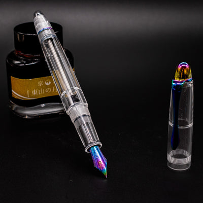 Nahvalur Fathom Fountain Pen Pride 2025 open at an angle with clear body and rainbow accents