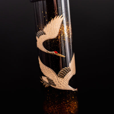 Namiki Yukari Double Crane barrel closeup with flying cranes in raised maki-e and raden
