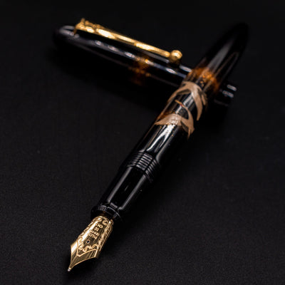 Closeup of Namiki Yukari Double Crane 18k gold nib angled toward camera.