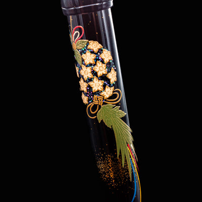 Detailed view of lower barrel design on Namiki Yukari Maki-e Fountain Pen featuring maki-e glitter and foliage