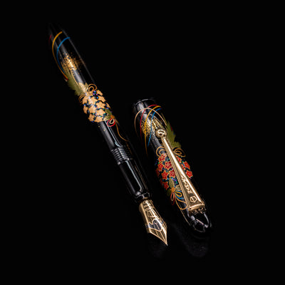 Full view of uncapped Namiki Yukari Maki-e Fountain Pen - Herb Decoration with floral and ribbon motifs