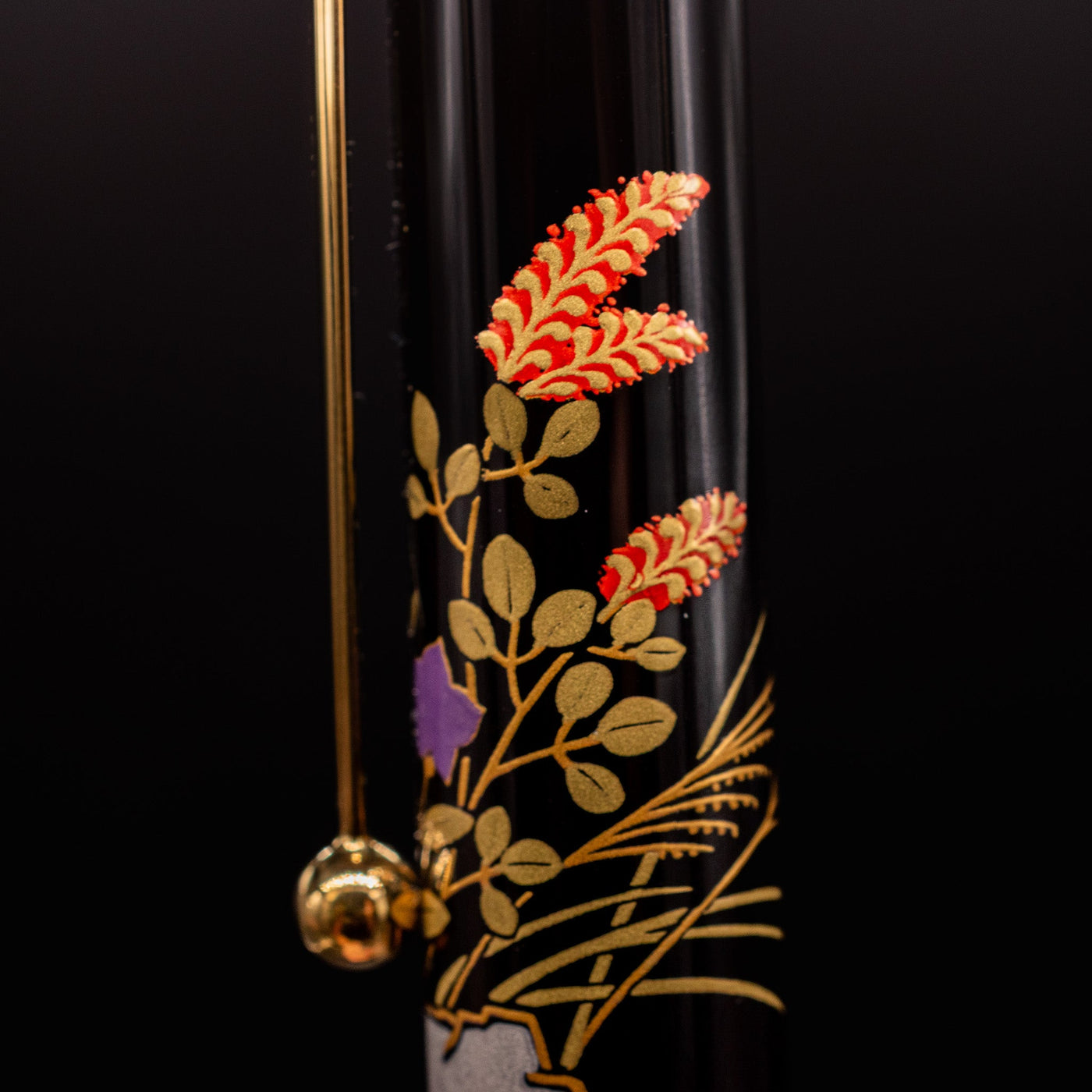 Closeup of Namiki Yukari Zodiac Boar Maki-e artwork on pen cap - detailed Japanese craftsmanship