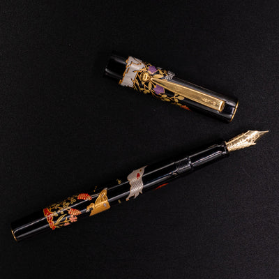 Overhead view of Namiki Yukari Zodiac Boar fountain pen - luxury Maki-e lacquer pen