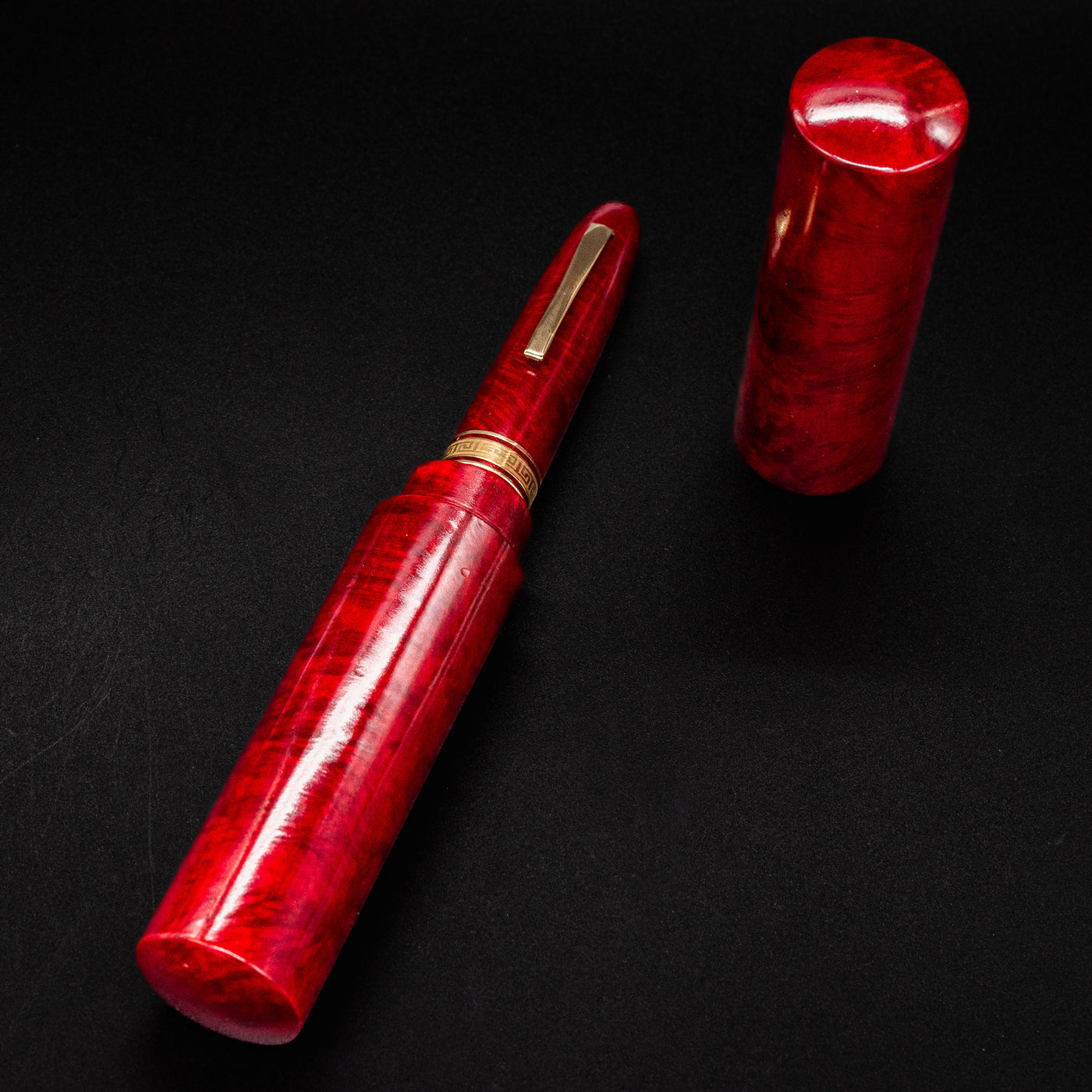 OMAS AM87 Briarwood fountain pen displayed inside its pen tube with lid removed