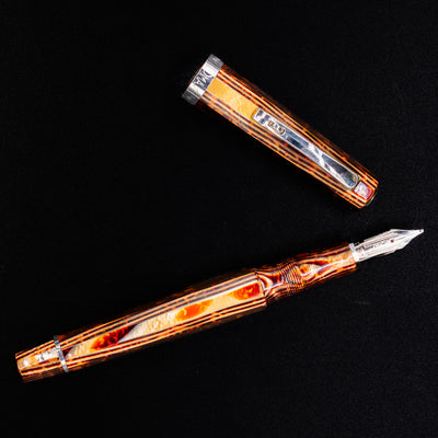 Detailed view of the Omas Brown Arco ST barrel and cap with silver trim on preowned fountain pen